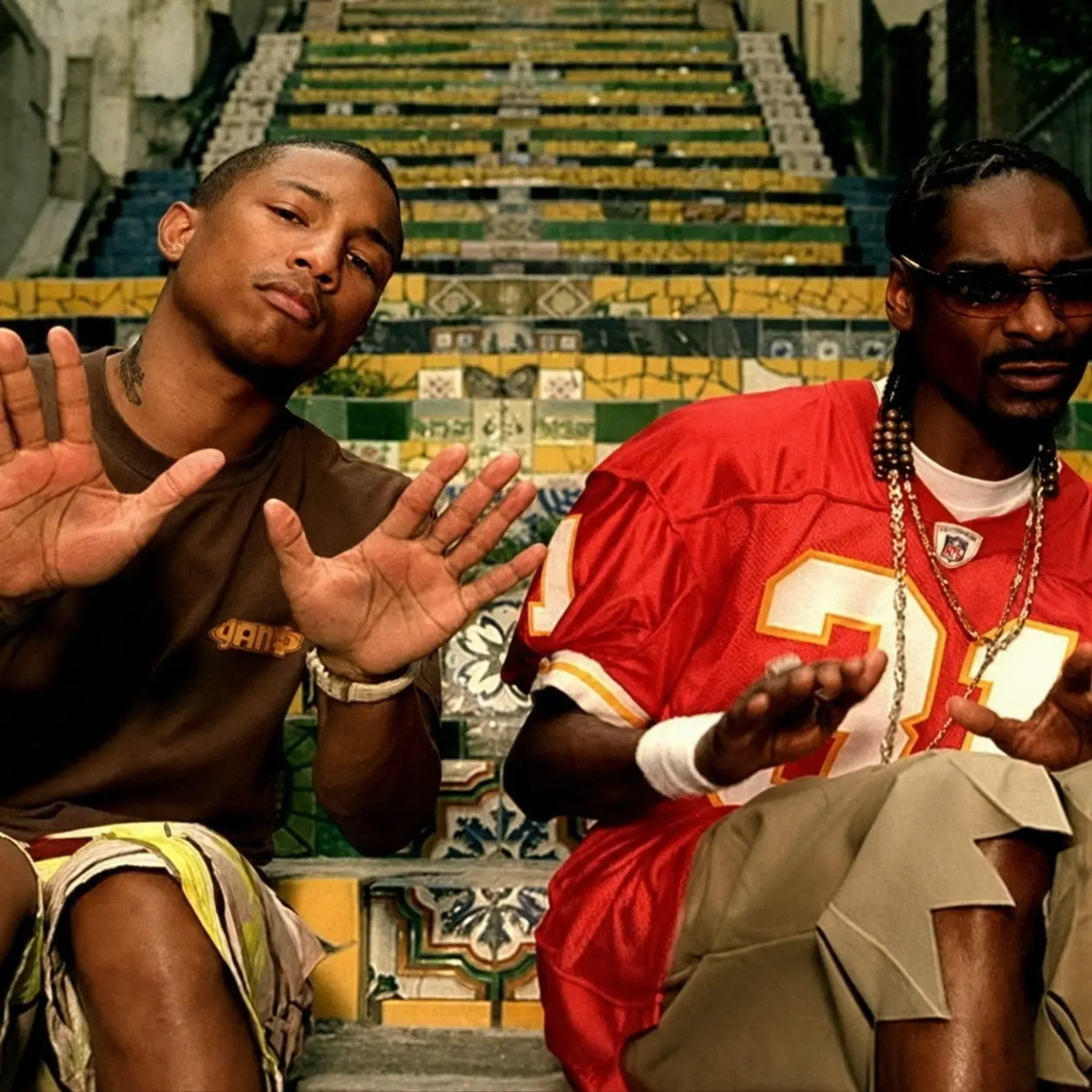 Pharrell Williams and Snoop Dogg sitting on Rio's Selarón Steps