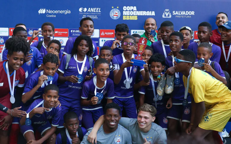 Young football players celebrating together in Salvador